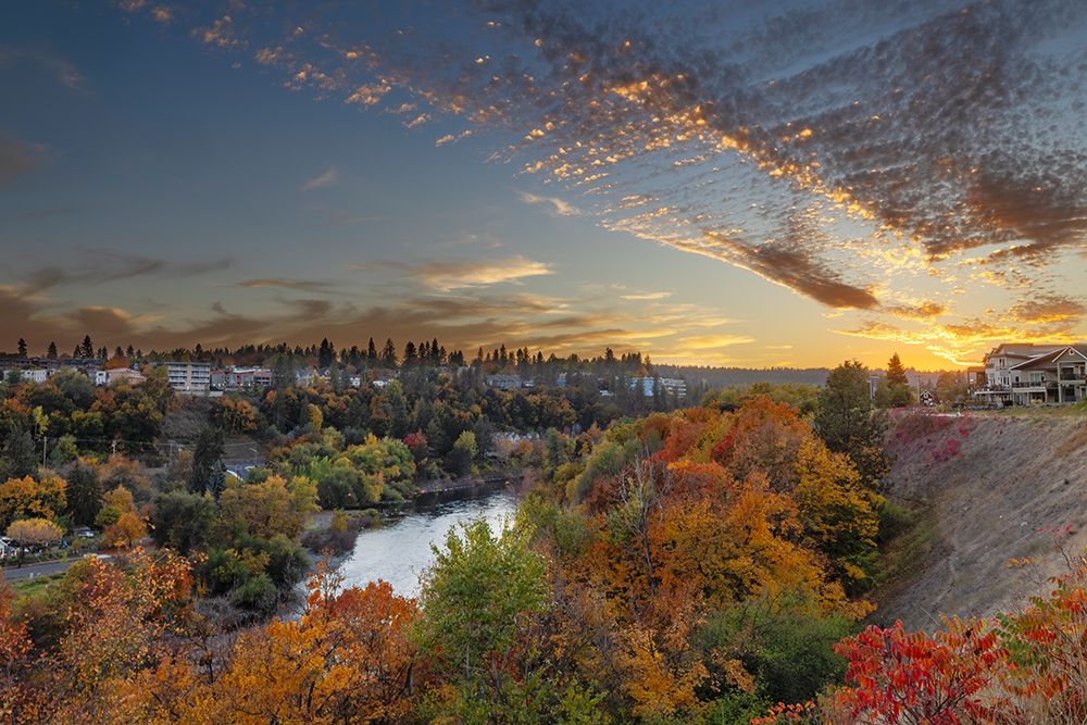 Sunset skies over autumn color along the Spokane River in Spokane, Washington State, USA